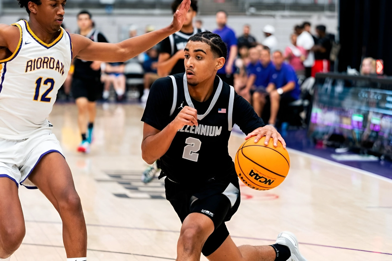 A young man dribbles the basketball during a game.