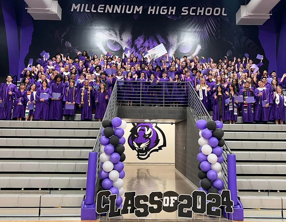 A group of people in the stands at a high school.